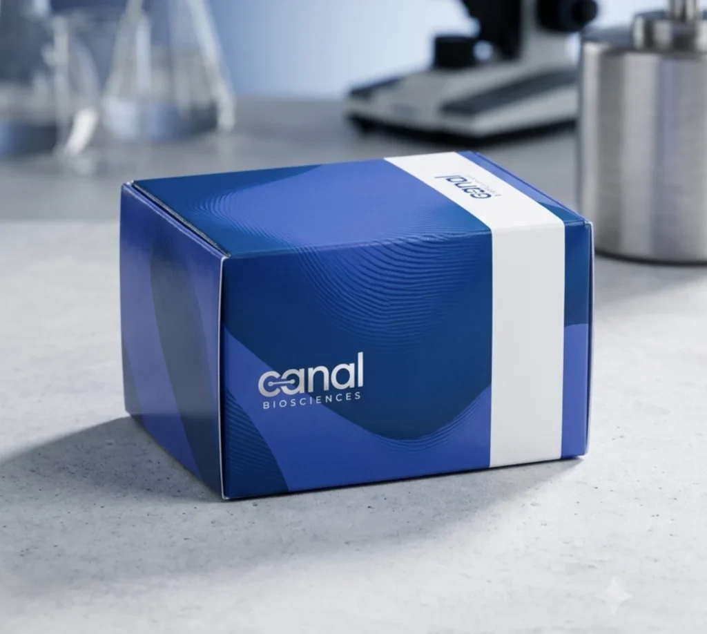 A professional product shot of Canal Biosciences DNA prep kit on a lab counter, with a blurred microscope and glassware in the background.